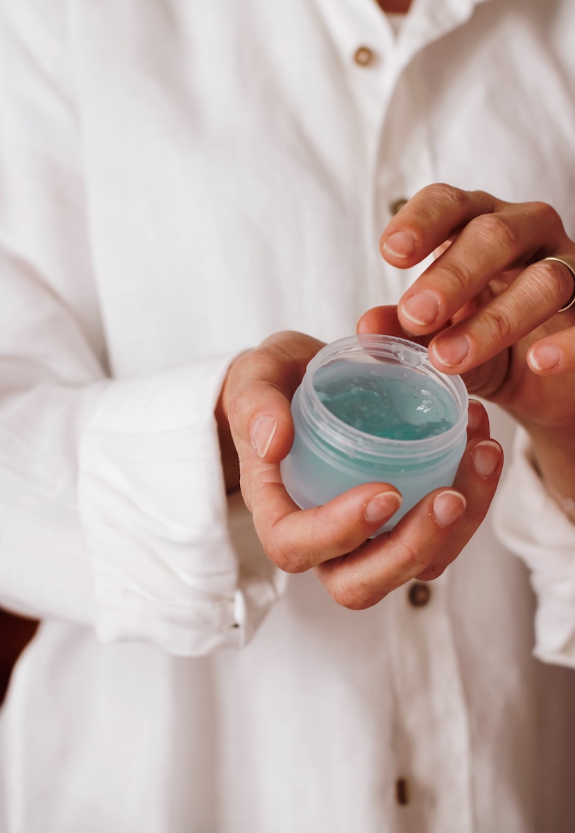 Photo by Nataliya Melnychuk person holding blue plastic container