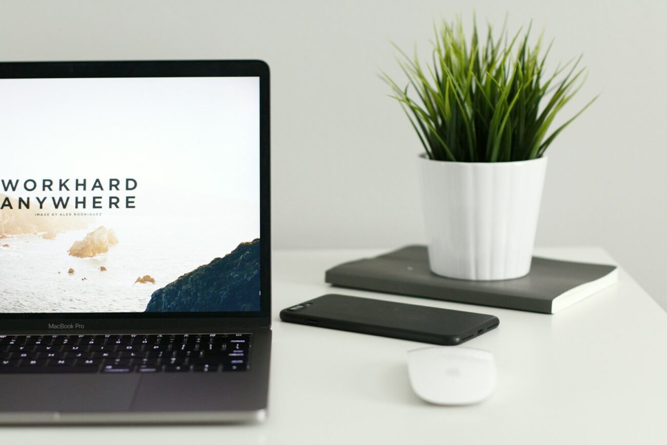 White-labeled business automation and client management platform built for yoga instructors, wellness studios, and hybrid service providers. 4 MacBook Pro near green potted plant on table